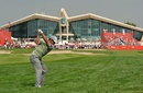 Pablo Larrazabal plays out of the rough towards the magnificent clubhouse in Abu Dhabi