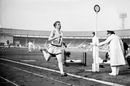 Oxford University's Chris Chataway breaks the tape to win the mile