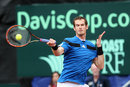Andy Murray hits a forehand against Donald Young during the USA-Great Britain Davis Cup tie