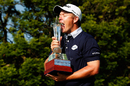 George Coetzee celebrates with the trophy after winning the Joburg Open