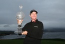Jimmy Walker poses with the trophy