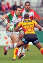 Biarritz's Damien Traille takes on the Dragons defence