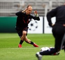 Arjen Robben stretches in training