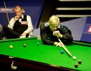Neil Robertson plays with the rest as Steve Davis watches on