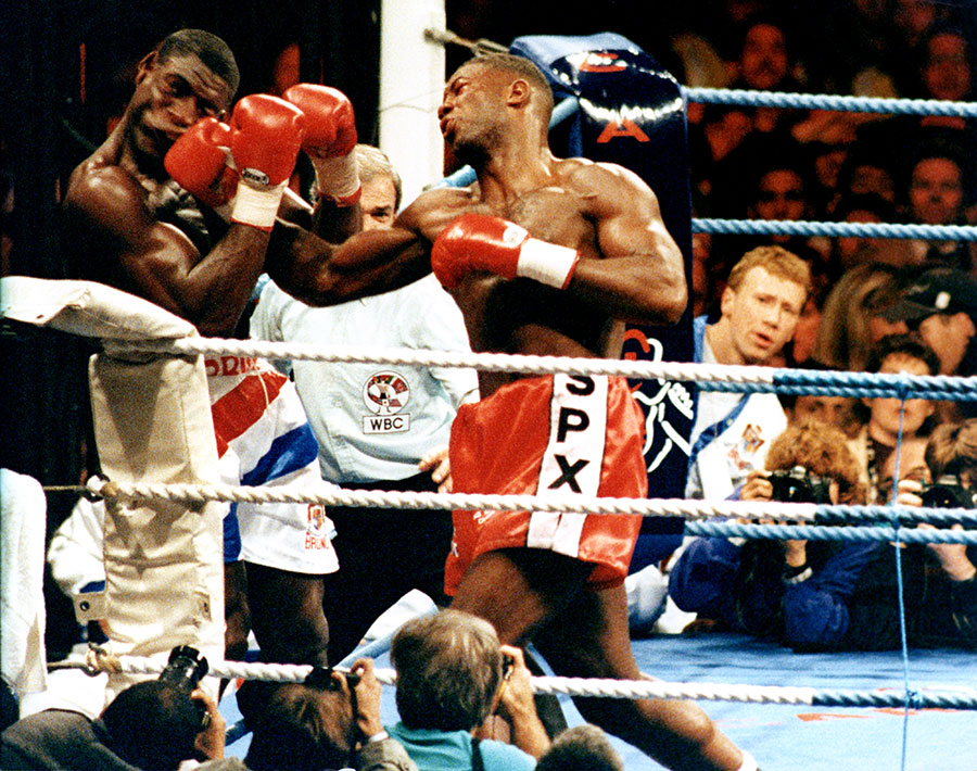 Lennox Lewis connects with a punch against Frank Bruno at Cardiff Arms Park