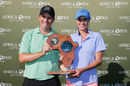 Thomas Aiken and wife Kate pose with the Africa Open trophy