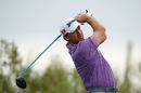Graeme McDowell watches his drive on the second hole