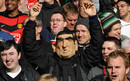 A Manchester United fan wearing an Eric Cantona mask