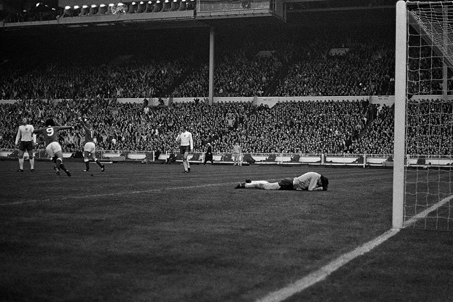 Gordon Banks lies on the turf after being beaten by West Germany's first goal, scored by Uli Hoeness