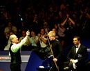 Steve Davis waves to the crowd following his defeat to Neil Robertson
