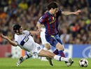 Cristian Chivu tackles Lionel Messi