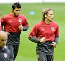 Diego Forlan and Sergio Aguero warm up ahead of the second leg