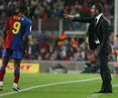 Pep Guardiola speaks with Samuel Eto'o