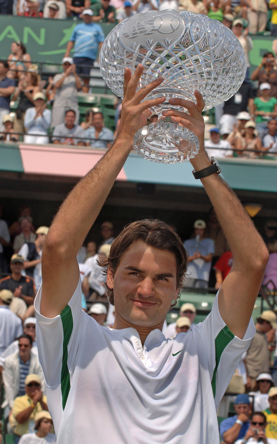 Roger Federer lifts the trophy after beating Ivan Ljubicic