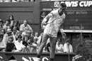 Pat Cash plays a shot during his 6-4 9-7 6-4 victory over Jeremy Bates in the opening singles match on Court No.1