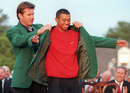 Nick Faldo presents 1997 Masters winner Tiger Woods with his green jacket