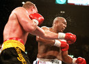 Axel Schulz lands a punch on George Foreman in their heavyweight world title bout