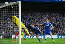 John Terry and Gary Cahill watch the ball hit the crossbar as Mark Schwarzer stretches