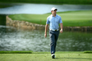 Rory McIlroy walks to the 17th tee during the first round