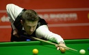 Mark Selby plays a shot on the red