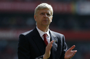 Arsene Wenger gestures to the crowd during a lap of honour