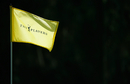 A flagstick blows in the wind during a practice round ahead of the Players Championship