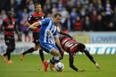 James McArthur and Armand Traore battle for the ball