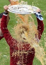 Bayern Munich coach Pep Guardiola is showered with beer
