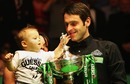 Ronnie O'Sullivan celebrates with his son after winning the World Snooker Championship
