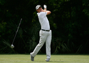 Justin Rose reacts to his tee shot on the fifth hole during the third round