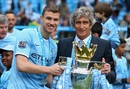 Edin Dzeko and Manuel Pellegrini hold the Premier League trophy