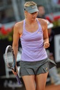 Maria Sharapova reached the third round of the Italian Open after beating Monica Puig 6-3 7-5
