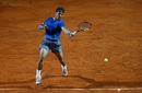 Rafael Nadal flies with a forehand