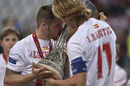Sevilla left-back Alberto Moreno kisses the Europa League trophy