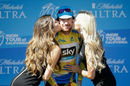 Bradley Wiggins is given a kiss as he is presented with the yellow jersey after stage four