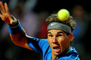 Rafael Nadal returns the ball to Andy Murray