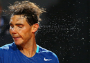 Rafael Nadal shakes off the sweat after his win over Grigor Dimitrov
