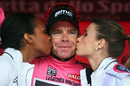 New race leader Cadel Evans celebrates on the podium after the eighth stage of the Giro d'Italia
