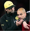 Jurgen Klopp puts Pep Guardiola in a headlock after the Spaniard led his side to the DFB Cup