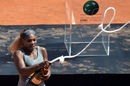 Serena Williams pops the champagne after successfully defending her title