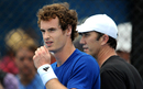 Andy Murray takes a break with coach Darren Cahill as he practices for his first round match