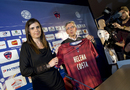 Helena Costa holds her jersey during her official presentation as Clermont's new coach