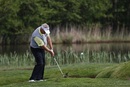 Colin Montgomerie chips on the second fairway during the first round of the Senior PGA Championship