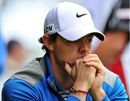 Rory McIlroy's mind appeared to be elsewhere but remains in contention