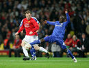 Wayne Rooney and Claude Makelele battle for possession 