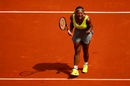Serena Williams celebrates a point during her first round match with Alize Lim