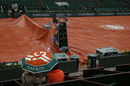 The courts are covered at Roland Garros as rain pours down in Paris