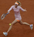 Maria Sharapova plays a shot in her opening round match against Ksenia Pervak