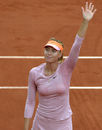 Maria Sharapova waves to the crowd after her first round victory
