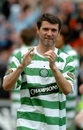 Roy Keane applauds the fans